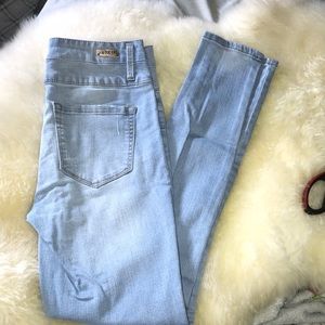 High waisted light wash colored jeans